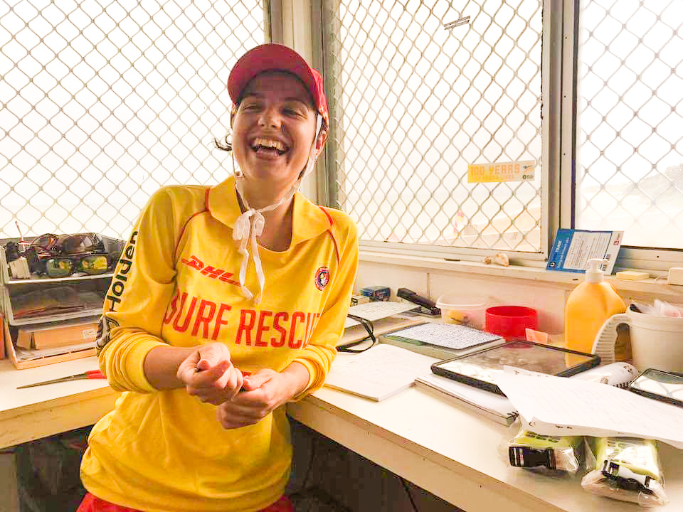 Female patroller laughs in the radio room.